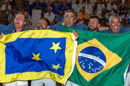 A sport-fishing team celebrating at the 2024 Offshore World Championship tournament awards ceremony.